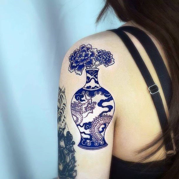 Incredible Flower Vase Tattoo For Ladies