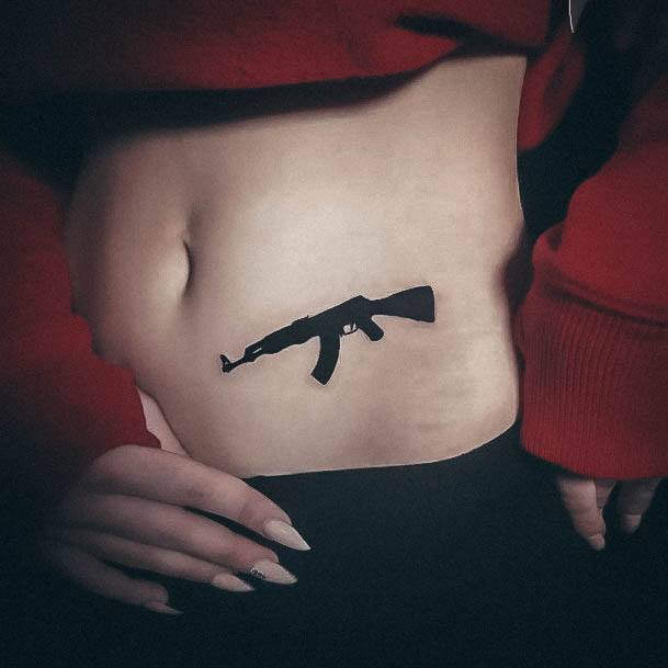 Incredible Gun Tattoo For Ladies