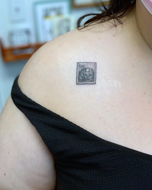 Incredible Postage Stamp Tattoo For Ladies