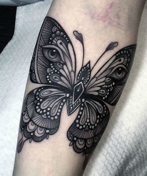 Intricate Design With Eyes On Butterfly Tattoo Women Forearms