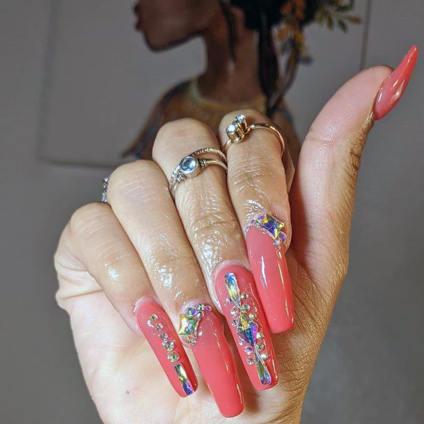 Jewel Art On Long Coral Hued Nails For Women