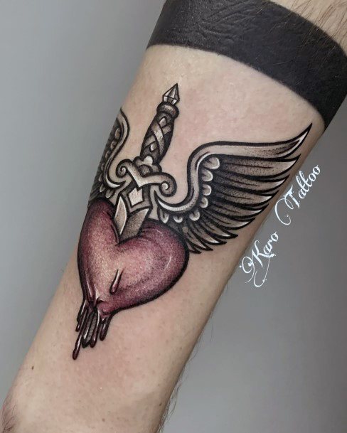 Ladies Dagger Heart Tattoo Design Inspiration