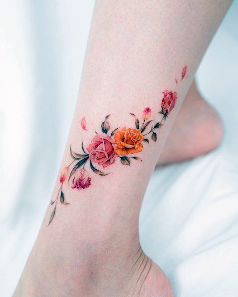 Ladies Flower Petal Tattoo Design Inspiration