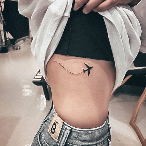 Lady With Elegant Airplane Tattoo Body Art