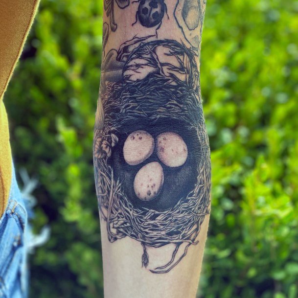 Lady With Elegant Birds Nest Tattoo Body Art