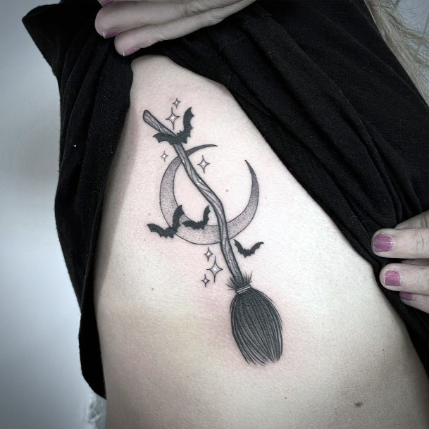 Lady With Elegant Broomstick Tattoo Body Art