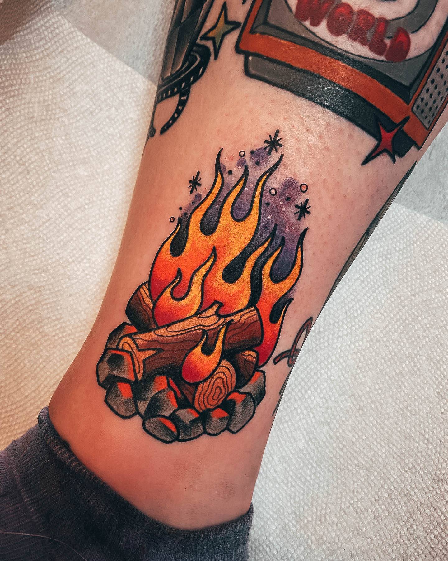 Lady With Elegant Campfire Tattoo Body Art