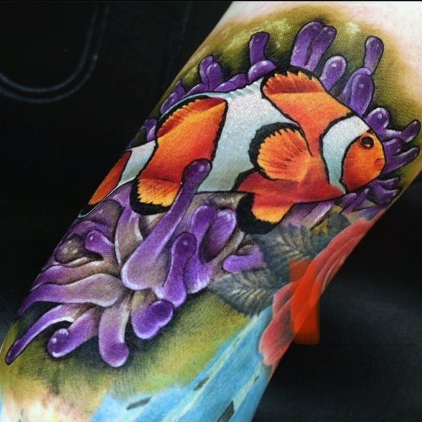 Lady With Elegant Clown Fish Tattoo Body Art