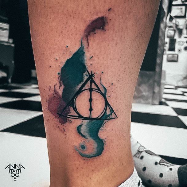 Lady With Elegant Deathly Hallows Tattoo Body Art