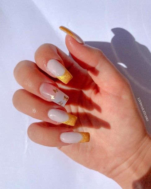 Lady With Elegant Gold French Tip Nail Body Art