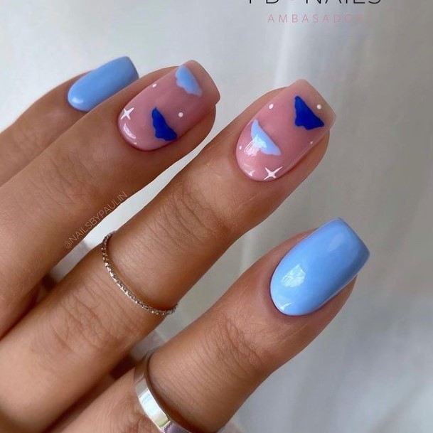 Lady With Elegant Light Blue Nail Body Art