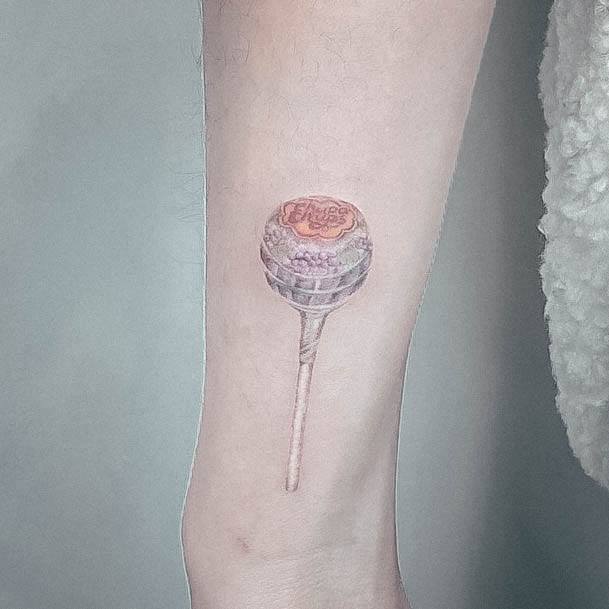 Lady With Elegant Lollipop Tattoo Body Art