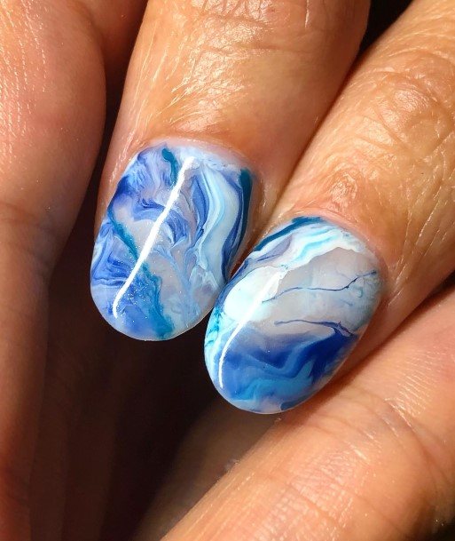 Lady With Elegant Marble Nail Body Art