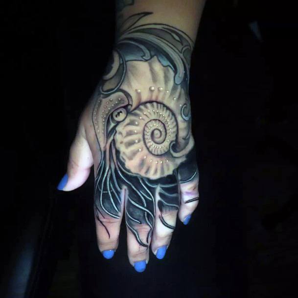 Lady With Elegant Nautilus Tattoo Body Art