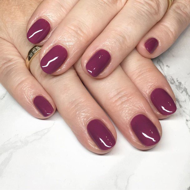 Lady With Elegant Plum Nail Body Art