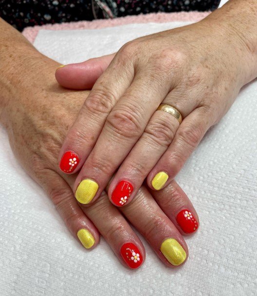 Lady With Elegant Red And Yellow Nail Body Art