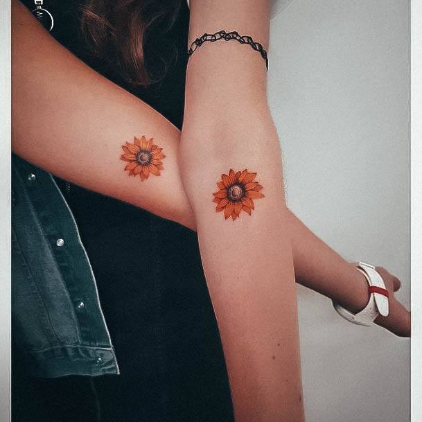 Lady With Elegant Small Sunflower Tattoo Body Art