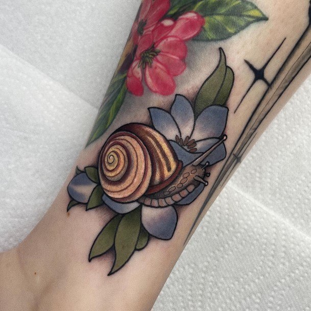 Lady With Elegant Snail Tattoo Body Art