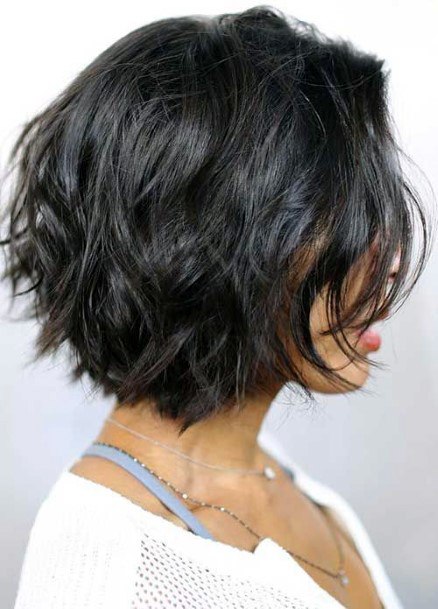 Light Black Hair On Female Shaggy Textured Layers Throughout