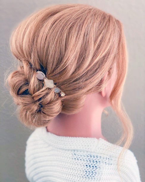 Light Strawberry Blonde Female With Traditional Bun And Golden Pearl Barrette