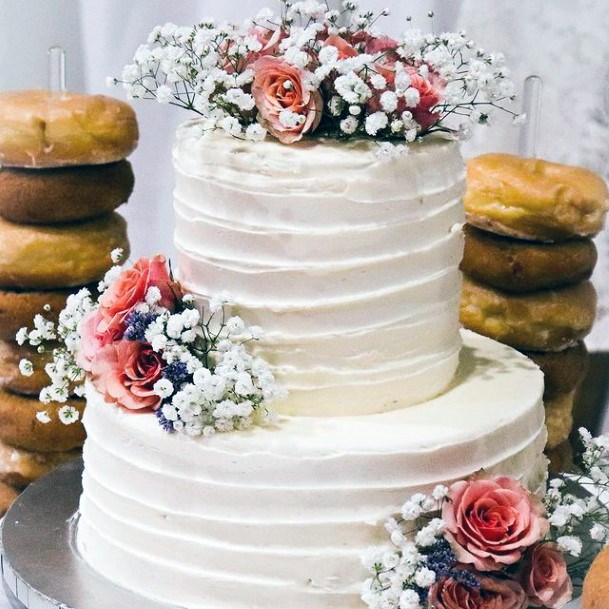 Light White And Pink Florals On Rustic Wedding Cake