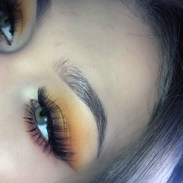 Long Lashed Women Orange And Brown Eyeshadow Art