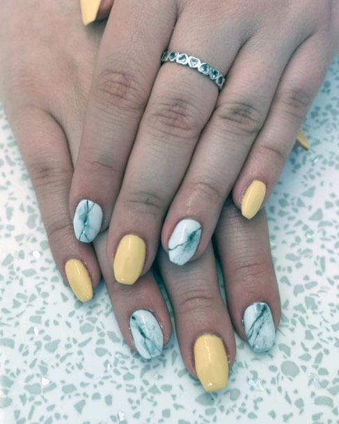 Lovely Adorable Soft Yellow And Marble White Nail Design For Ladies