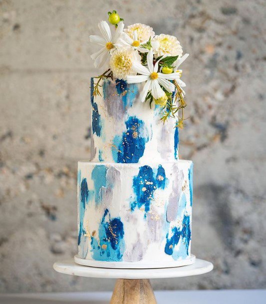 Lovely Blue Designs On White Wedding Cake