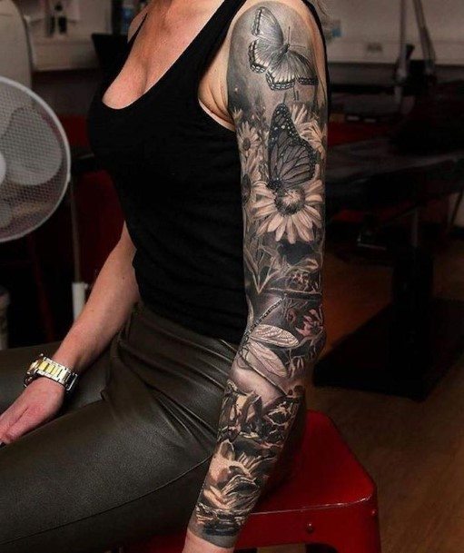 Lovely Garden With Butterfly Tattoo On Arms Women