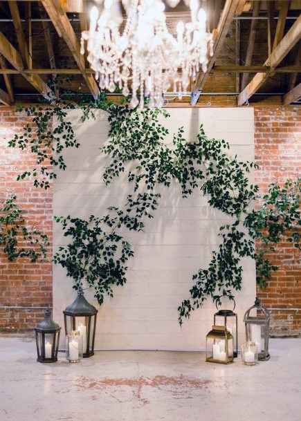 Lovely White Backdrop Green Plants Rustic Lantern Wedding Inspiration