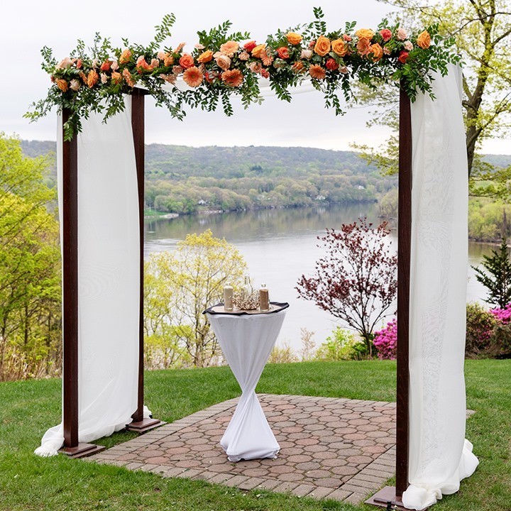 Lovely White Draped Wedding Arch Flowers