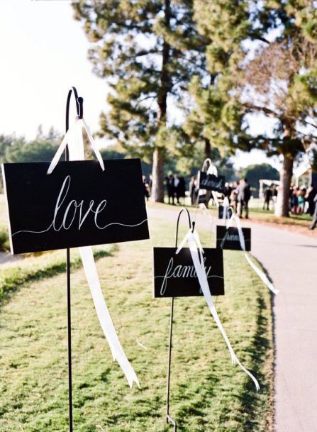 Lovely Words On Black Board And White Stand Wedding Decor