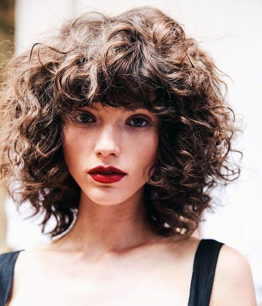 Lush Hairstyle On Female With Tons Of Volume And Natural Face Framing Presence