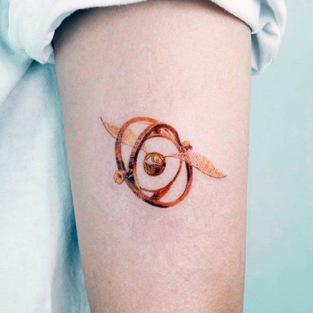 Magnificent Golden Snitch Tattoo For Girls