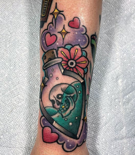 Magnificent Poison Bottle Tattoo For Girls