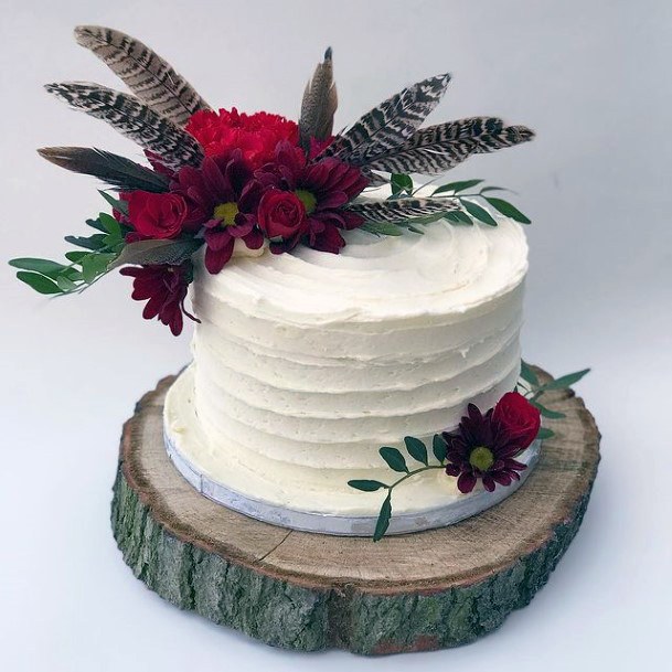 Maroon Flowers On Rustic Wedding Cake