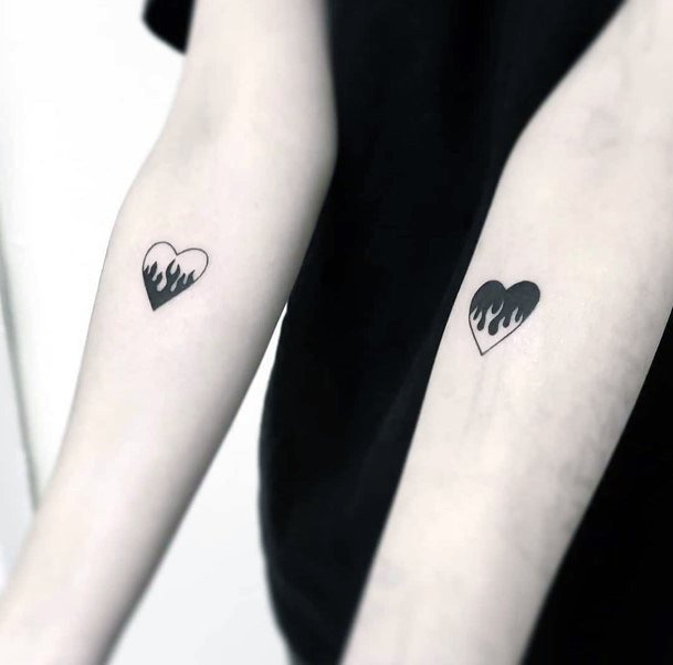 Matching Forearm Flaming Heart Tattoo Designs For Women