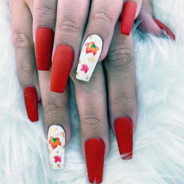 Matte Red Orange Nails With White Autumn Leaf Accent For Women