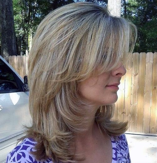 Medium Length Hairstyles For Women Over 50 Side Swept Bangs Feathered Layers