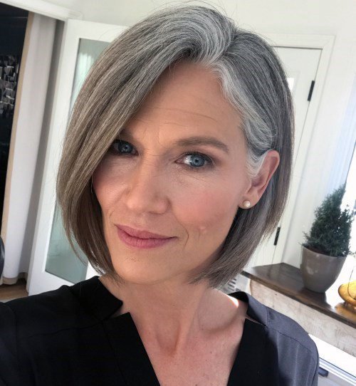 Medium Length Hairstyles For Women Over 50 Sleek Natural Grey Bob