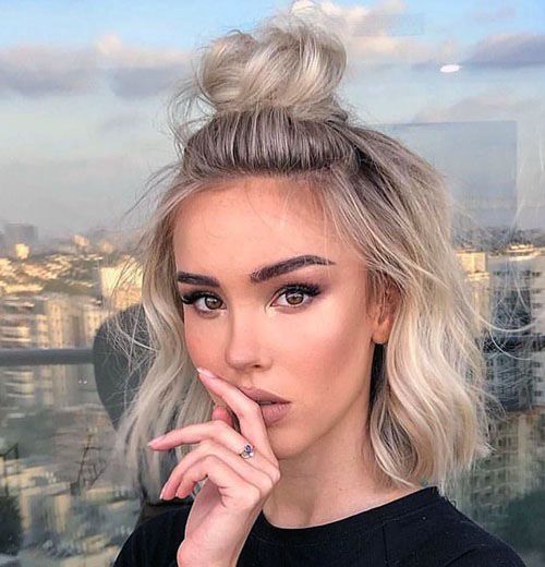 Messy Half Top Knot On Wavy Ash Blonde Female Hair