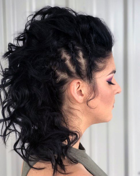 Messybusy Dark Haired Woman With Corn Rows Leading To A Mohawk Hairstyle