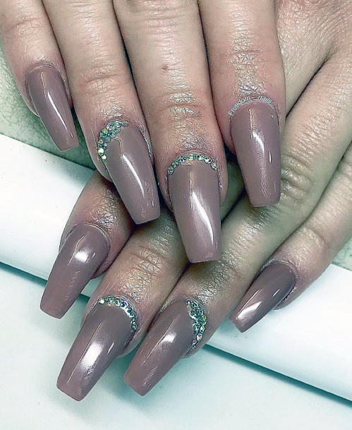 Metallic Purple Colored Nails With Crystals At Base