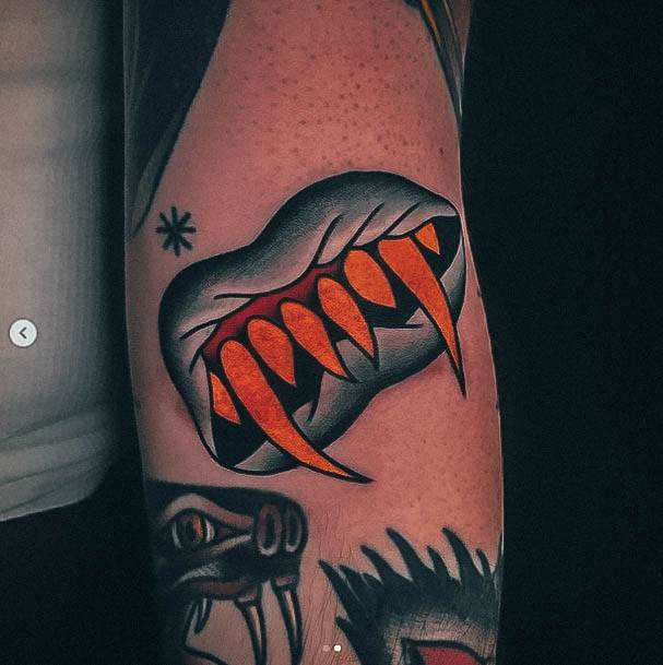 Minimal Fangs Tattoo For Women