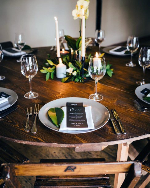 Minimal Wooden Table And Chairs With Greenery And Candle Centerpieces Rustic Wedding Ideas