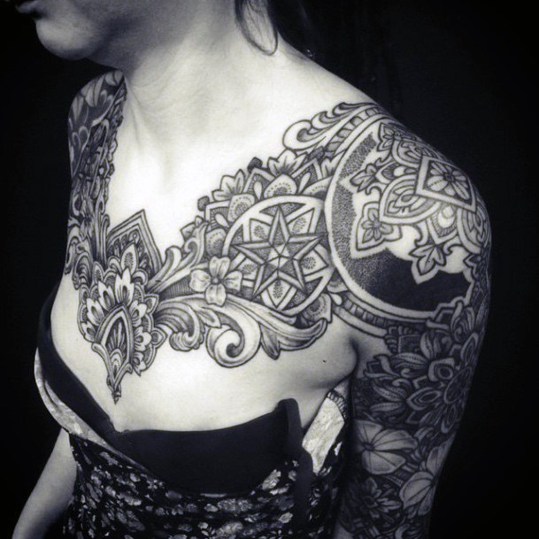 Monumental Black Chest Tattoo For Women