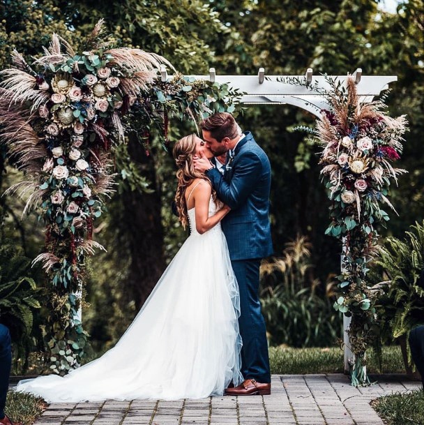 Moody Boho Dried Grasses And Dark Greenery Wedding Arch Ideas