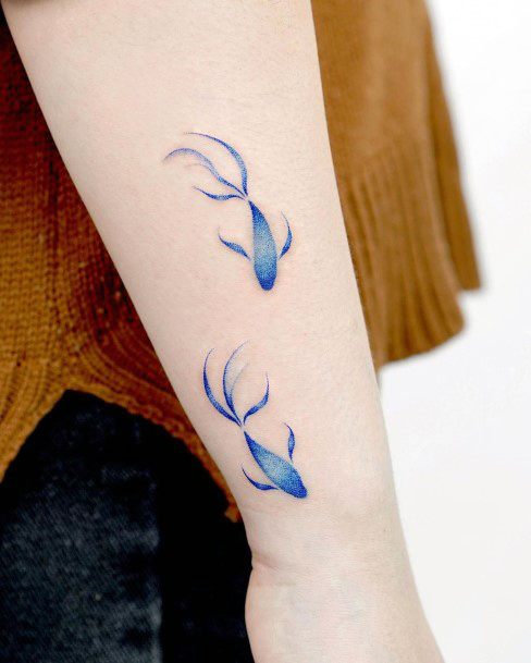 Neat Betta Fish Tattoo On Female