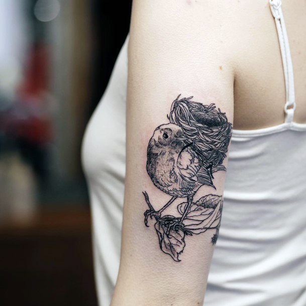 Neat Birds Nest Tattoo On Female