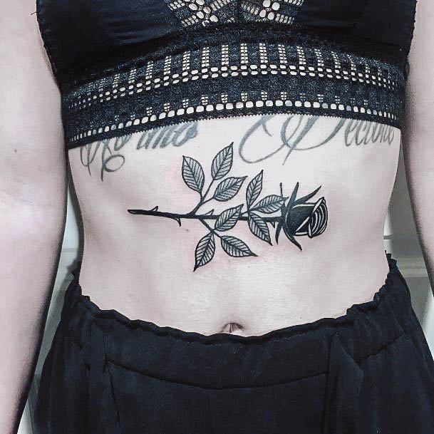 Neat Black Rose Tattoo On Female